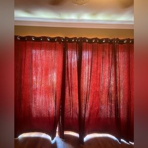 Red floor to ceiling curtains